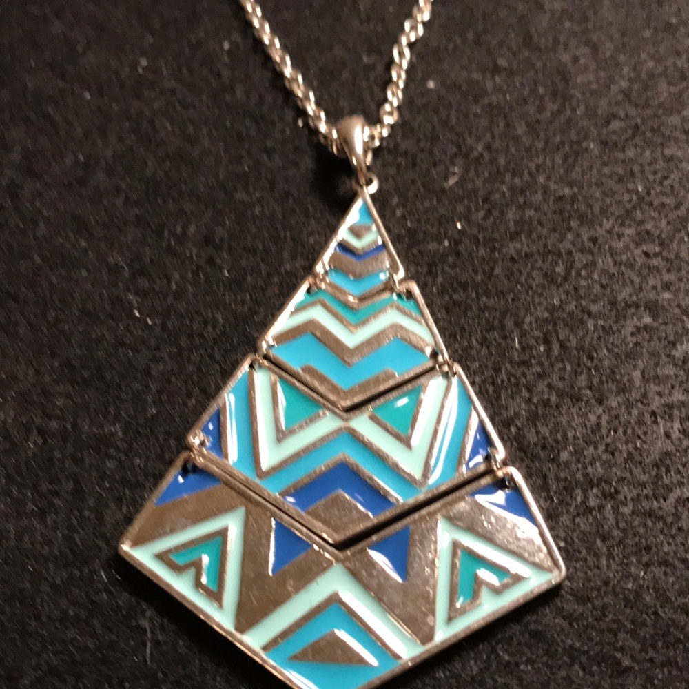 Silver color necklace with fun moving metal charm